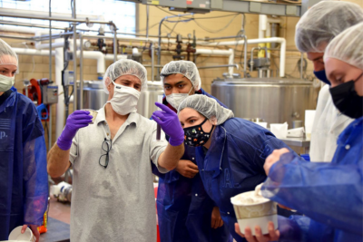 UConn Creamery manager Bill Sciturro shows students some of the unique technical aspects of preparing high quality ice cream. (Jason Sheldon/UConn Photo)