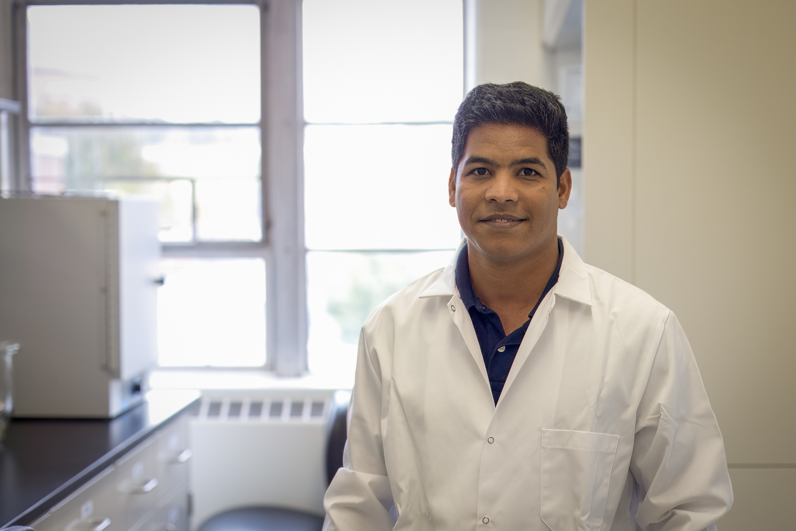 Elias Uddin of the Department of Animal Science in his laboratory. (Jaran Smith/UConn Photo)