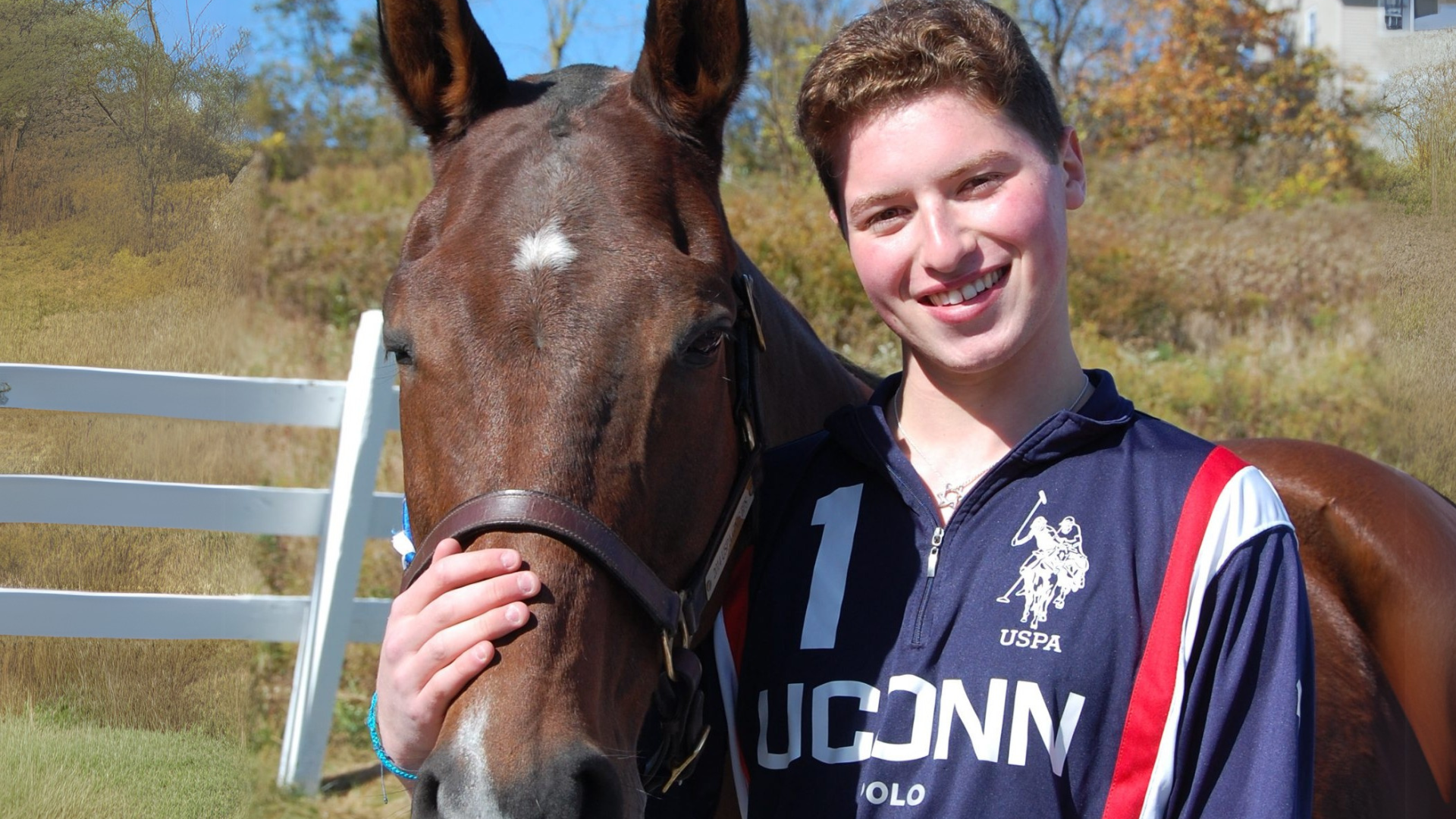 Student posing next to horse for portrait photo.