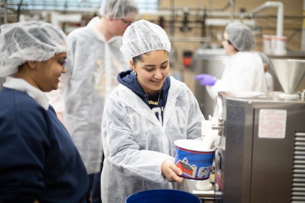 Students making ice cream inside of creamery.