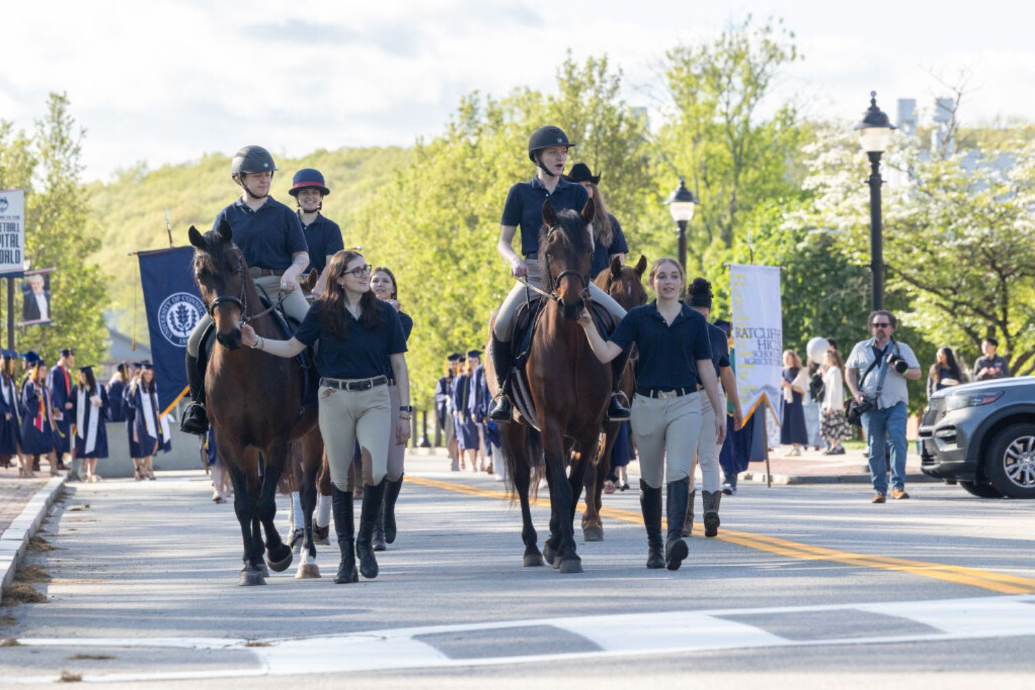 Students leading horses on Fairfield Way